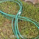 Roll Up Garden Hoses in Figure Eights