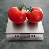 Weight of the 2 tomatoes is 1 pound 7-3/4 ounces, an average of a